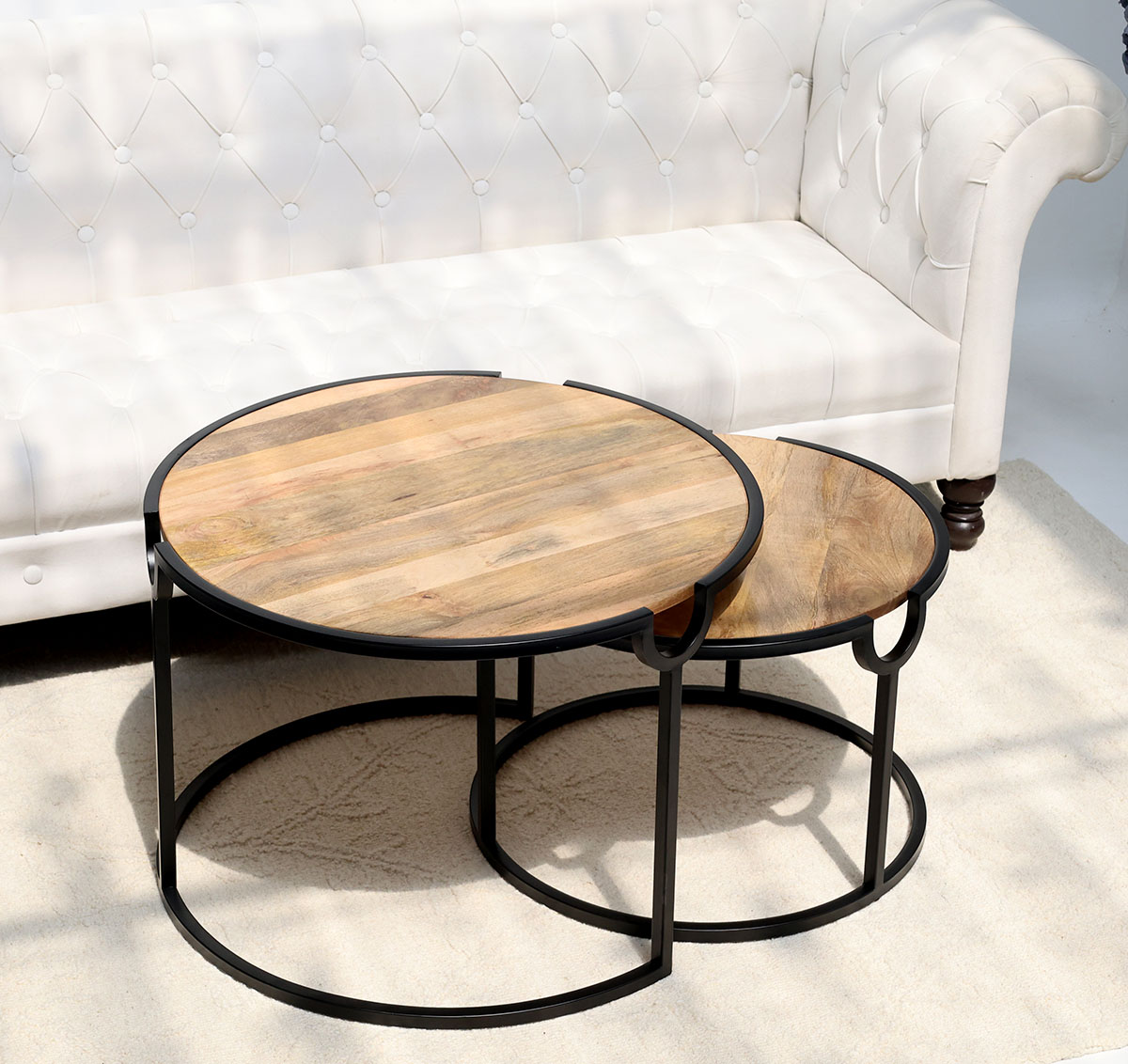 Angled Top View – Modern Nesting Coffee Table Set GH-001 Angled top view of round wooden nesting coffee table with black metal frame GH-001