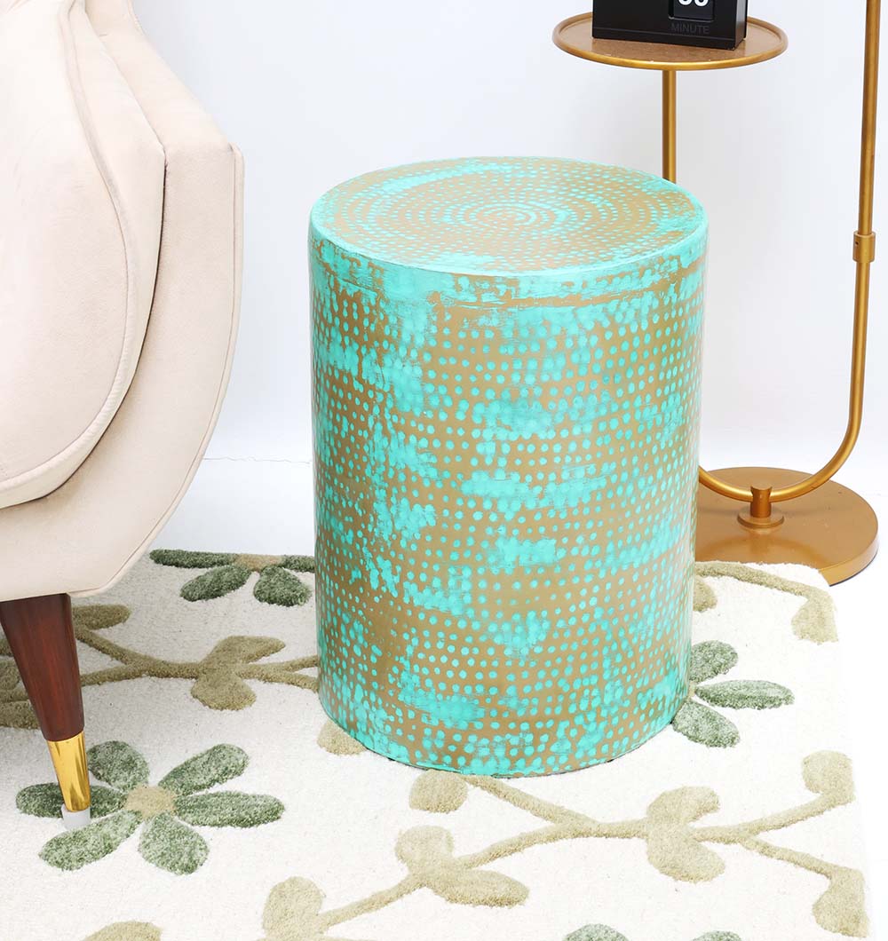 Modern Round Side Table – Turquoise Dot Design with Golden Iron Base Beside Couch Round modern side table with turquoise dot pattern and golden iron base placed beside a couch