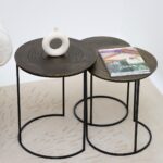 Set of modern round nesting side tables GH-070 with antique brass finish tops and black iron bases styled in contemporary living space