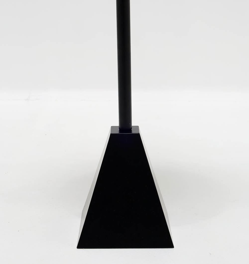 Close-Up – Pyramid Base of Modern Black Metal Side Table | Minimalist Industrial Design Close-up of pyramid-shaped metal base of modern black side table showing sleek matte finish