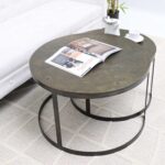 Modern nesting coffee table set with round wooden tops and sleek black powder-coated metal frames, featuring an industrial-modern style.