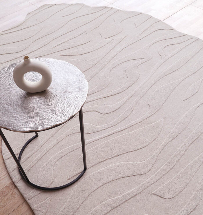 Off White Color Decor Rug HTWV 115 with coffee table on top – handwoven wool-cotton rug in living room