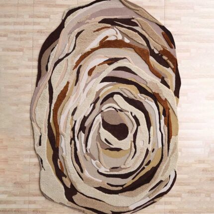 A large Shaped Multicolor Area Rug with a hand-carved vortex pattern in brown and cream tones.