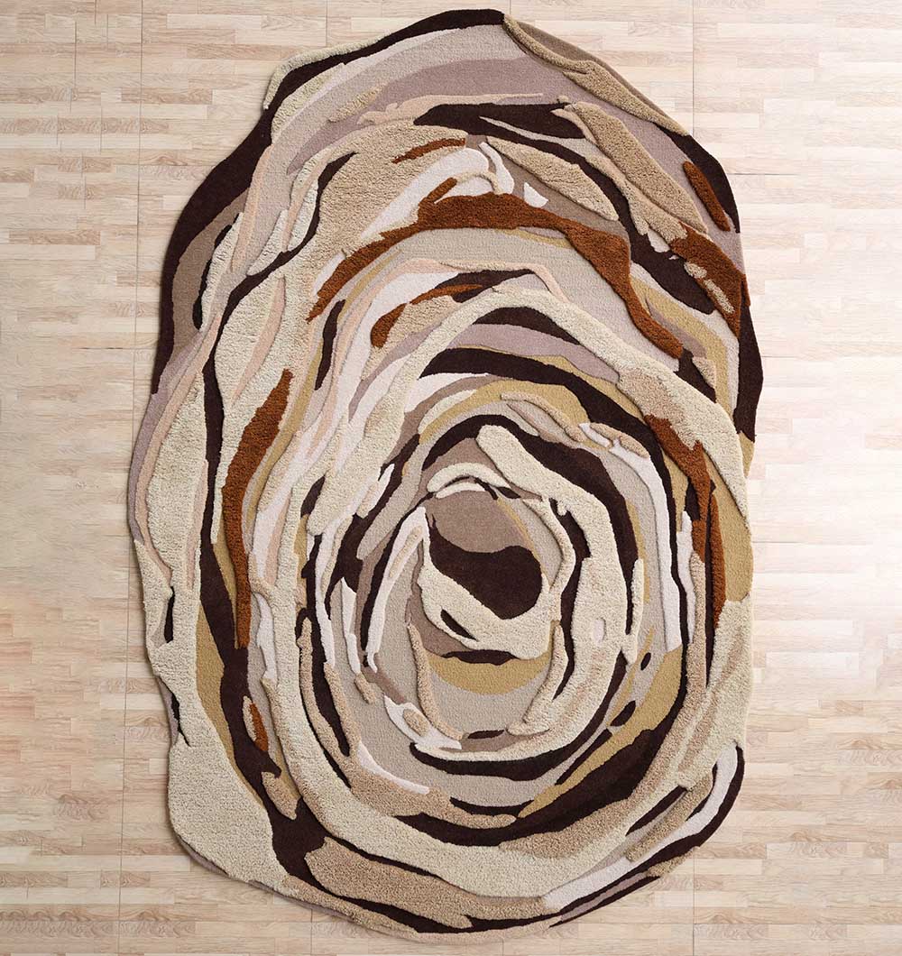 Shaped Multicolor Area Rug - HTW 126 (200x300cm) A large Shaped Multicolor Area Rug with a hand-carved vortex pattern in brown and cream tones.