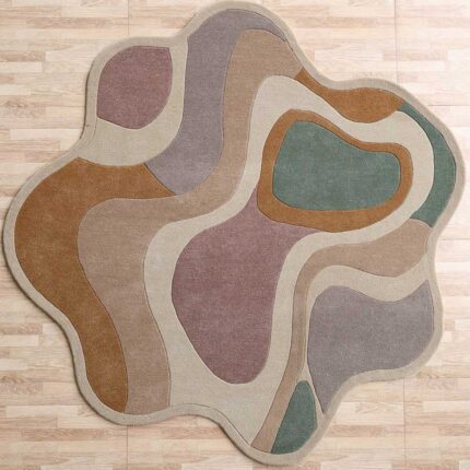 A Multicolor Shaped Area Rug with organic, wavy layers in earth tones like ochre, rose, and sage green.