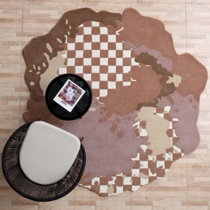 A Bespoke Rug with an irregular organic silhouette and a checkered pattern in terracotta and cream.