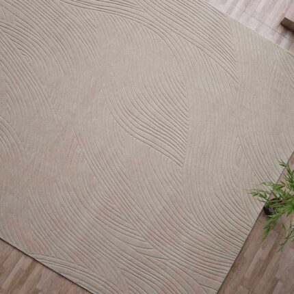 A massive, premium entry for wool rugs featuring a 300 x 400 cm handmade beige rectangle carpet with a hand-carved texture.