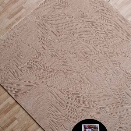 A high-quality entry for cotton rugs featuring a handmade beige rectangle carpet with a deep, hand-carved linear pattern.